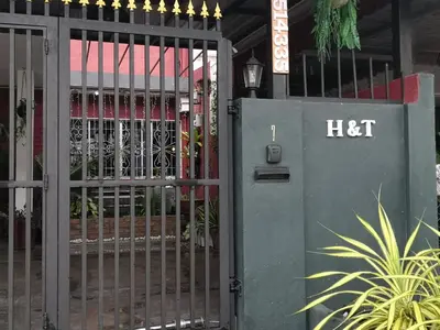 a metal gate with a hot sign on it at H&T Vintage Decor Homestay in Ipoh