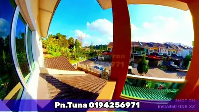 a view of a courtyard from a window of a building at Tuna Cameron Homstay in Brinchang