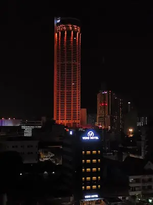 a sota sign on top of a building at night at VENO HOTEL in George Town