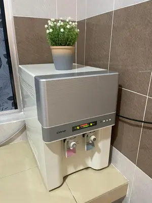 a toilet paper dispenser in a bathroom with a plant at No 61 Nazirin Homestay Tmn Indah Raya 2 Manjung Lumut in Lumut