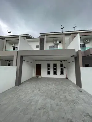a large white house with a large parking lot at No 61 Nazirin Homestay Tmn Indah Raya 2 Manjung Lumut in Lumut