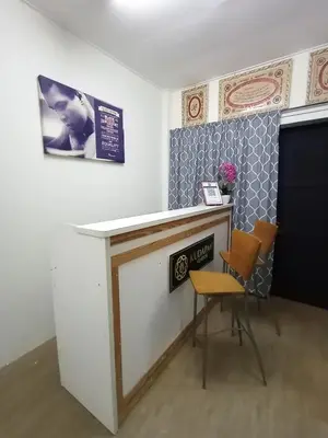 a bar with a table and two chairs in a room at Minimalist Shop Stay @ Royal Town in Kuala Kangsar