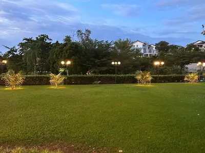 a park at night with lights in the grass at Beach Resort 19 Home Stay SRI SAYANG APARTMENT BATU FERRINGHI 3BEDROOM in Batu Ferringhi