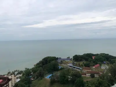an aerial view of a town and the ocean at Beach Resort 19 Home Stay SRI SAYANG APARTMENT BATU FERRINGHI 3BEDROOM in Batu Ferringhi