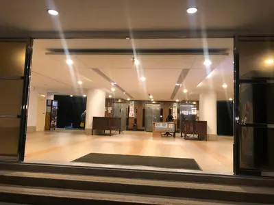 a view of a lobby with a room with tables and chairs at Beach Resort 19 Home Stay SRI SAYANG APARTMENT BATU FERRINGHI 3BEDROOM in Batu Ferringhi