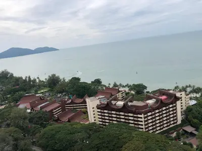 an aerial view of a resort with the ocean behind it at Beach Resort HOME STAY SRI SAYANG 05 APARTMENT BATU FERRINGHI 2BEDROOM in Batu Ferringhi