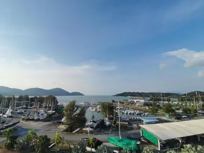 a view of a marina with boats in a harbor at Marina Island Lumut HomeHotel in Lumut