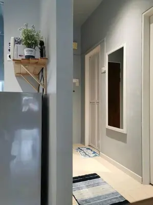 a kitchen with a refrigerator and a hallway at Cozy NEAR-BEACH Apartment ~The Napping House \u6d77\u6ee8\u516c\u5bd3~ in Batu Ferringhi