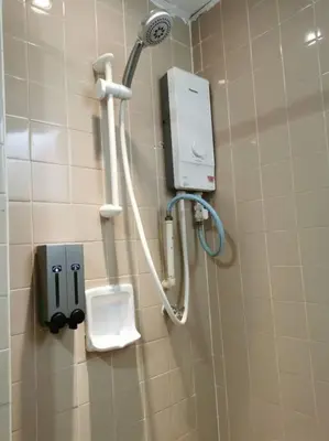 a public bathroom with a urinal and a shower at Cozy NEAR-BEACH Apartment ~The Napping House \u6d77\u6ee8\u516c\u5bd3~ in Batu Ferringhi