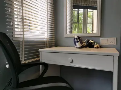 a room with a desk and a chair and a mirror at Cozy NEAR-BEACH Apartment ~The Napping House \u6d77\u6ee8\u516c\u5bd3~ in Batu Ferringhi