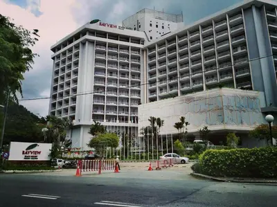 a large building with a sign on top of it at Cozy NEAR-BEACH Apartment ~The Napping House \u6d77\u6ee8\u516c\u5bd3~ in Batu Ferringhi