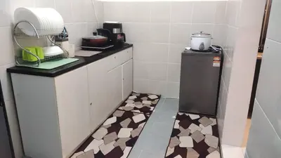 a small kitchen with a counter and a floor with a counter top at EMERALD MUSLIM HOMESTAY CAMERON HIGHLANDS in Cameron Highlands