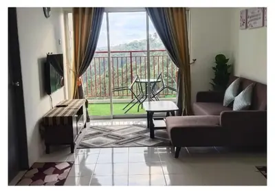 a living room with a couch and a large window at EMERALD MUSLIM HOMESTAY CAMERON HIGHLANDS in Cameron Highlands
