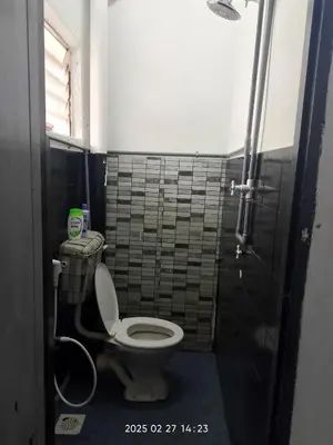 a bathroom with a toilet and a shower at Budget Homestay Impiana Adril in Ipoh