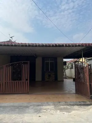 a house with a gate and a garage at Aqil Homestay Lunas Kulim for Mslim only in Lunas