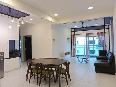 a dining room and living room with a table and chairs at Cameron Homestay @ Quintet in Tanah Rata