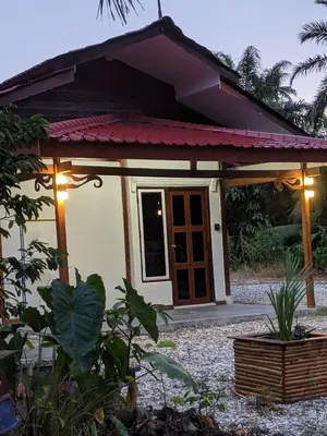a small house with a red roof at Denai Senja in Kuala Selangor