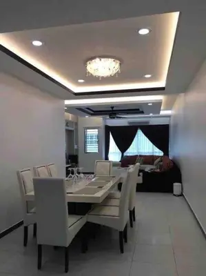 a dining room with a long table and chairs at Shuang Yang Sekinchan Homestay 3 in Sekincan