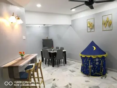 a dining room with a table and chairs and a room with a ceiling at TB HOMESTAY Tasek klebang(taman bertuah) 10pax wifi in Chemor