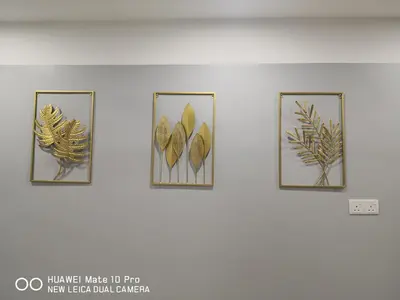 four framed prints of leaves on a wall at TB HOMESTAY Tasek klebang(taman bertuah) 10pax wifi in Chemor