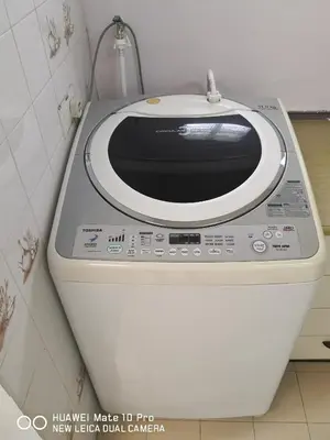 a microwave sitting on top of a toilet in a bathroom at TB HOMESTAY Tasek klebang(taman bertuah) 10pax wifi in Chemor