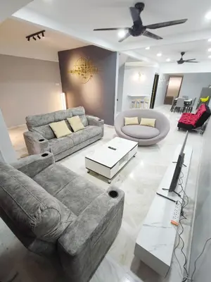 a living room with a couch and a table at TB HOMESTAY Tasek klebang(taman bertuah) 10pax wifi in Chemor