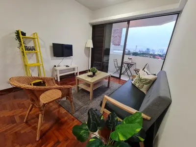 a living room with a couch and a table at JJ Home @ Jalan Burmah, Georgetown in George Town