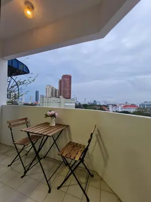 a table and chairs on a balcony with a view at JJ Home @ Jalan Burmah, Georgetown in George Town