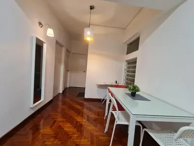 a dining room with a white table and chairs at JJ Home @ Jalan Burmah, Georgetown in George Town