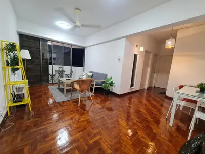 an open living room with wooden floors and a dining room at JJ Home @ Jalan Burmah, Georgetown in George Town