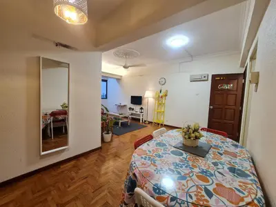 a room with a table and a dining room at JJ Home 2 , Jalan Burmah, Georgetown in George Town