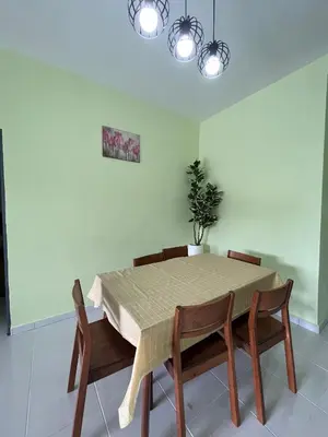 a dining room with a table and four chairs at Cameron Emerald Avenue Clover @ Brinchang in Brinchang