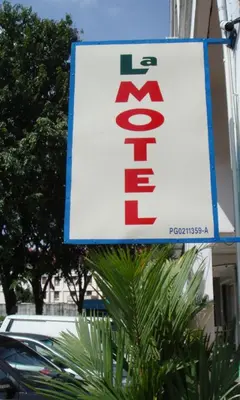 a sign on the side of a building at LA MOTEL in Sungai Petani