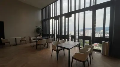 a restaurant with tables and chairs and large windows at 2BR Georgetown Luxury Suite #RoofTopPool #Beacon in George Town