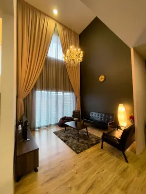 a living room with a couch and a table at Paradise Penthouse 5 bedrooms 5 bathrooms in Tanah Rata