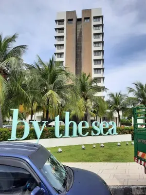 a car parked in front of a sign in front of a building at TESS - By The Sea, Batu Ferringhi Penang in Batu Ferringhi