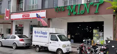 a white truck parked in front of a store at My Homestay N43 (14 pax) @ Golden Hills Night Market in Tanah Rata