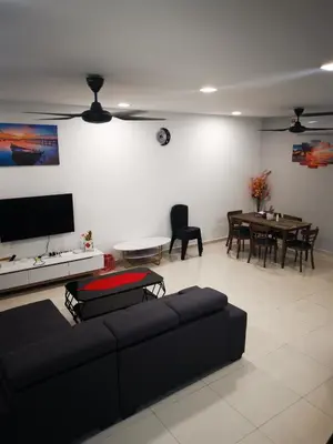 a living room with a couch and a table at 48 \u60a0\u4e4b\u5904NO . 48, PERSIARAN ALAM IMPIAN 3 VILLA RIADAH ALAM IMPIAN PANGKOR, 32300 PANGKOR , PERAK. in Pangkor