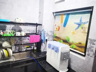 a kitchen with a sink and a counter top at 48 \u60a0\u4e4b\u5904NO . 48, PERSIARAN ALAM IMPIAN 3 VILLA RIADAH ALAM IMPIAN PANGKOR, 32300 PANGKOR , PERAK. in Pangkor