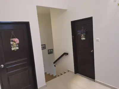 a hallway with two doors and a mirror at 48 \u60a0\u4e4b\u5904NO . 48, PERSIARAN ALAM IMPIAN 3 VILLA RIADAH ALAM IMPIAN PANGKOR, 32300 PANGKOR , PERAK. in Pangkor