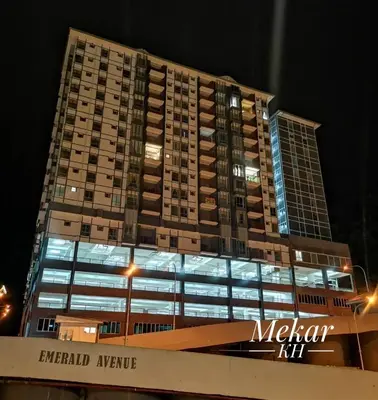a tall building with lights on in front of it at Mekar KH Homestay (Muslim) @ Brinchang in Brinchang