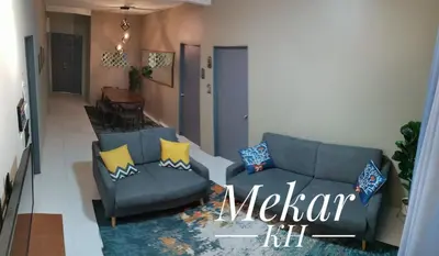 a living room with a couch and a chair at Mekar KH Homestay (Muslim) @ Brinchang in Brinchang