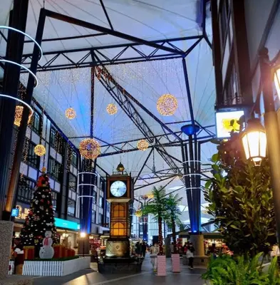 a shopping mall with a clock in the middle of it at Tiara Homestay 2 with 3 Bedroom, Unlimited Wifi - Brinchang in Brinchang