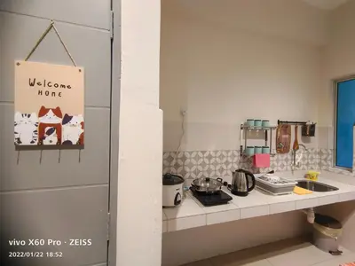 a kitchen with a counter and a counter top with a sink at PavilionVillie Ipoh in Kampong Sengat