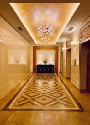 an empty hallway with a ceiling with a chandelier at Cozy Studio house /Soho Unit Near Kampar Utar in Kampar