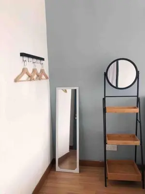 a room with a mirror and a shelf with shoes at Tropicana 218 Macalister Water Purifier High Floor in George Town