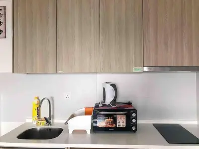 a kitchen counter with a microwave and a sink at Tropicana 218 Macalister Water Purifier High Floor in George Town