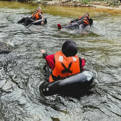 a group of people are in the water at Sahom Valley Resort - Agro & Eco Park in Kampar