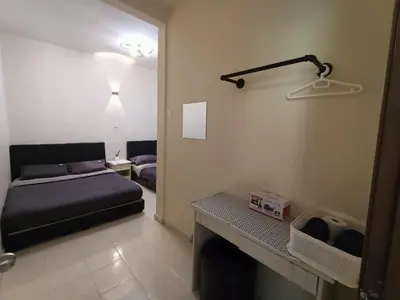 a living room with a couch and a bed in a room at Dream 2 in Cameron Highlands