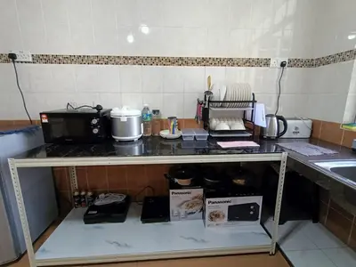 a kitchen with a counter top with a microwave at Dream 2 in Cameron Highlands